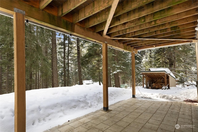 view of snow covered patio