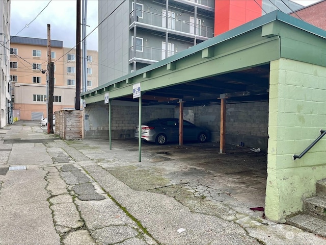 view of parking / parking lot featuring a carport