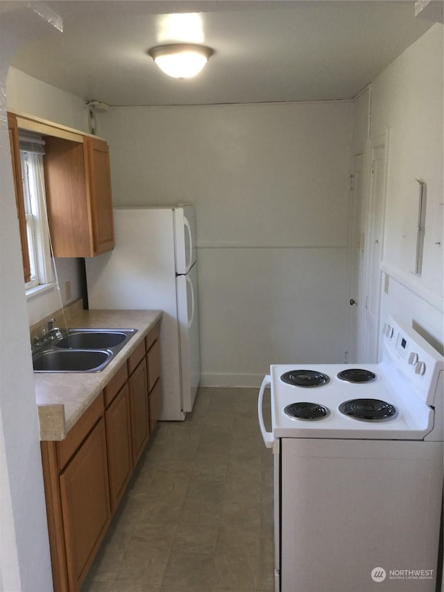 kitchen with electric stove and sink