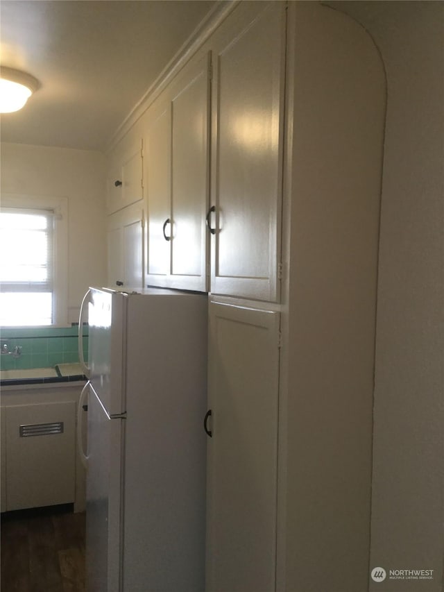 laundry room with dark hardwood / wood-style floors