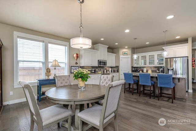 dining room with dark hardwood / wood-style flooring