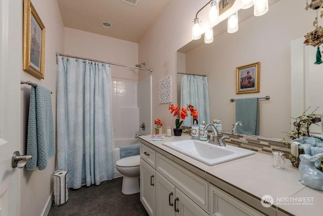 full bathroom featuring vanity, toilet, and shower / bath combo with shower curtain