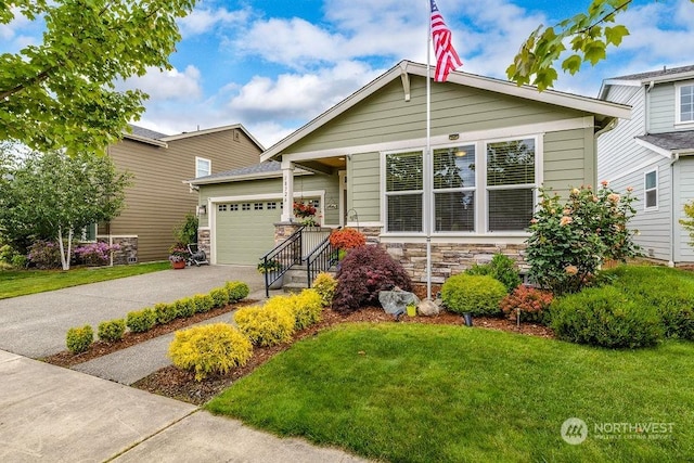 view of front of home featuring a garage and a front yard