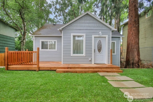 exterior space featuring a wooden deck and a yard