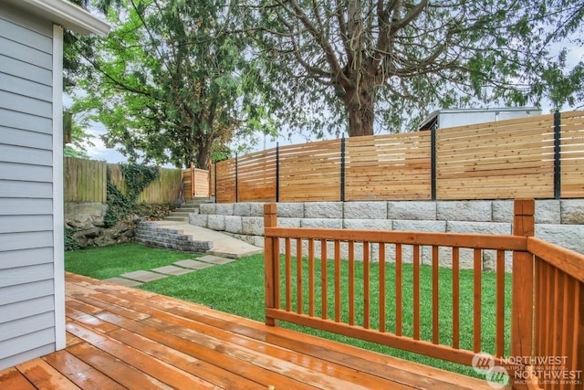 wooden terrace with a lawn