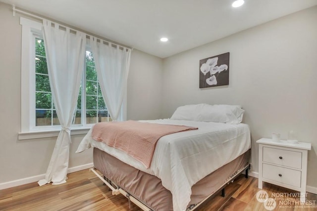 bedroom with light wood-type flooring