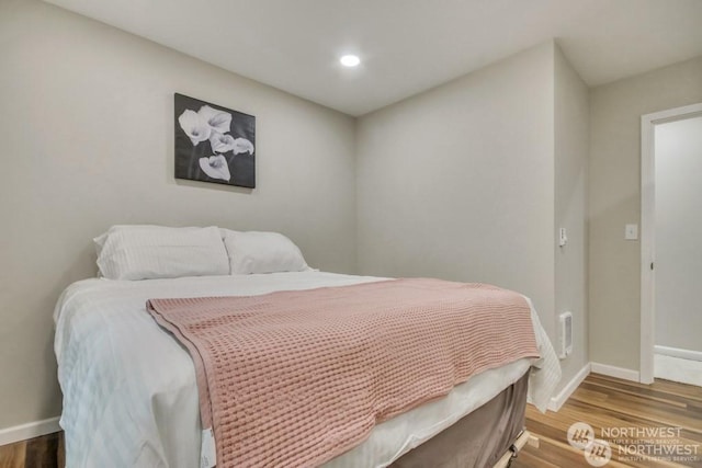 bedroom featuring hardwood / wood-style floors