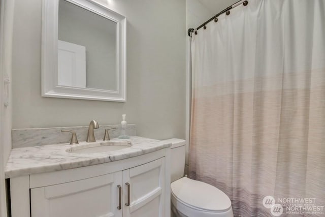 bathroom with vanity and toilet