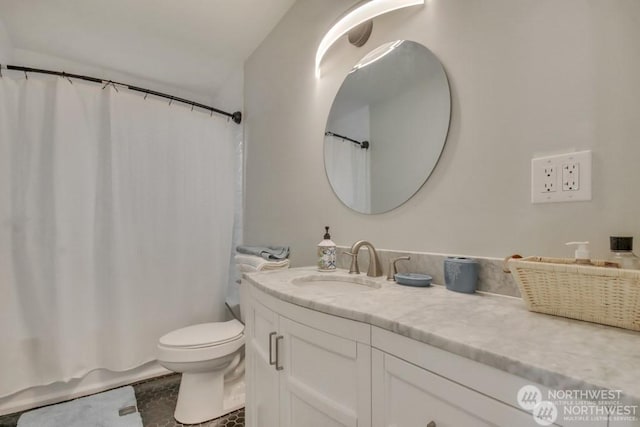 full bathroom featuring vanity, shower / bath combo, and toilet