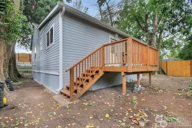 view of side of home featuring a deck