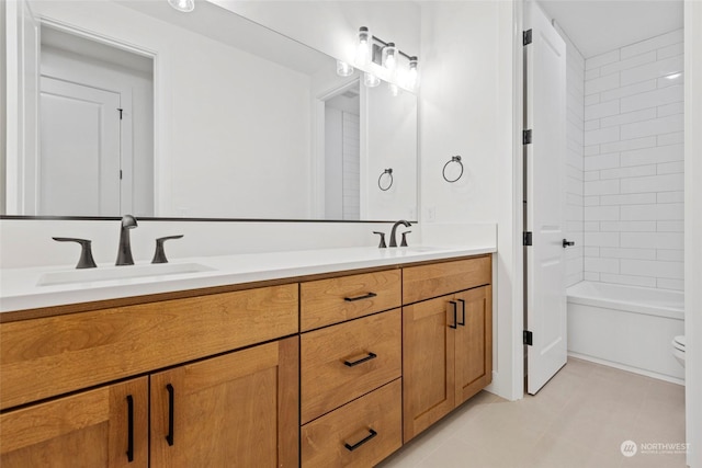 full bath with tub / shower combination, a sink, and double vanity