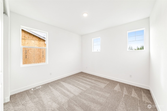 view of carpeted spare room