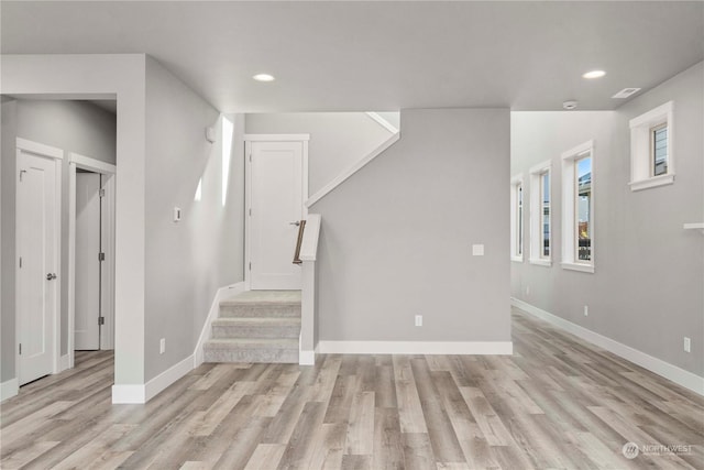 unfurnished living room with light wood-type flooring