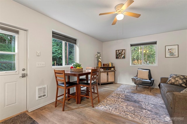 dining space featuring hardwood / wood-style flooring and ceiling fan