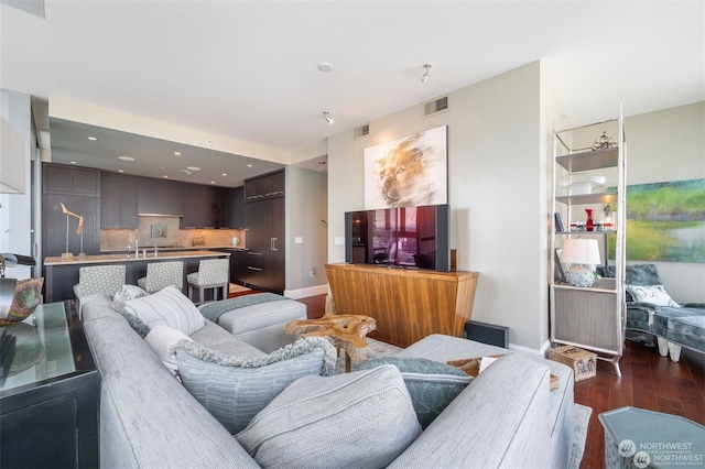 living room with dark hardwood / wood-style flooring