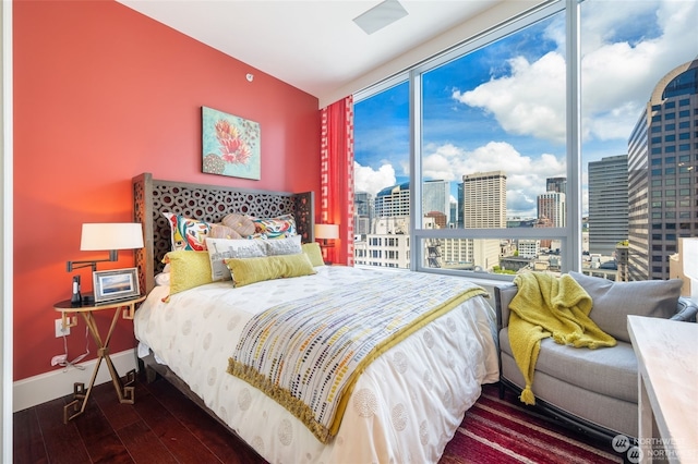 bedroom with hardwood / wood-style floors