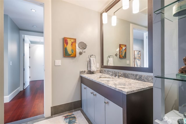 bathroom with vanity and hardwood / wood-style floors