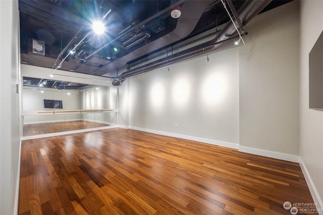 basement featuring wood-type flooring