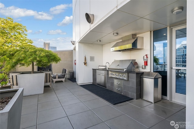 view of patio with an outdoor kitchen, a grill, and sink