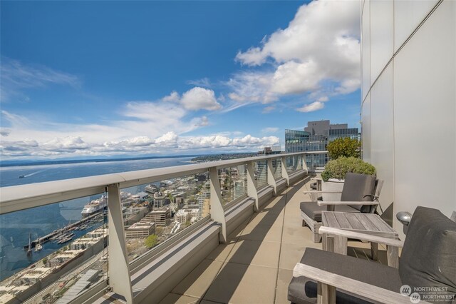 balcony featuring a water view