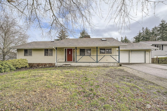 ranch-style house featuring a porch, a garage, and a front lawn