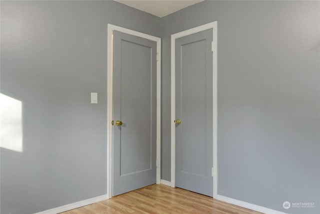 empty room with light hardwood / wood-style floors