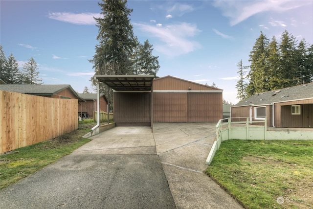 exterior space with a carport and a yard