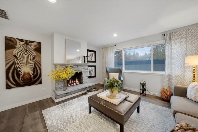 living room featuring hardwood / wood-style floors and a fireplace