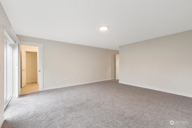 unfurnished room featuring carpet flooring