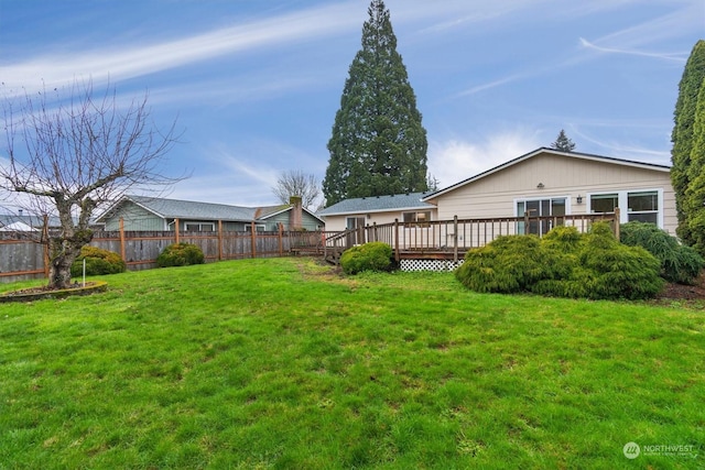 view of yard featuring a wooden deck