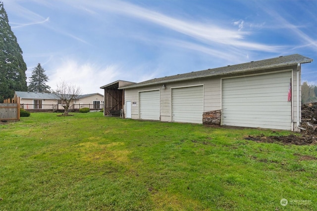 garage featuring a yard