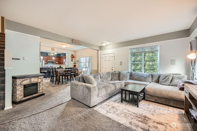 living room featuring carpet flooring and a wealth of natural light