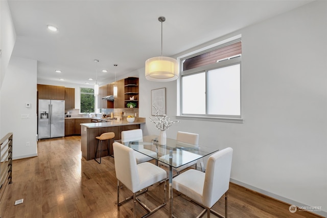 dining space featuring light hardwood / wood-style flooring