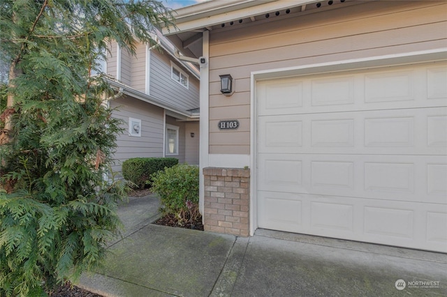 view of exterior entry featuring a garage