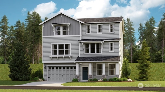 view of front of property featuring a garage and a front yard