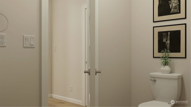 bathroom featuring toilet and hardwood / wood-style floors