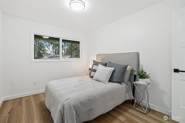 bedroom featuring hardwood / wood-style floors