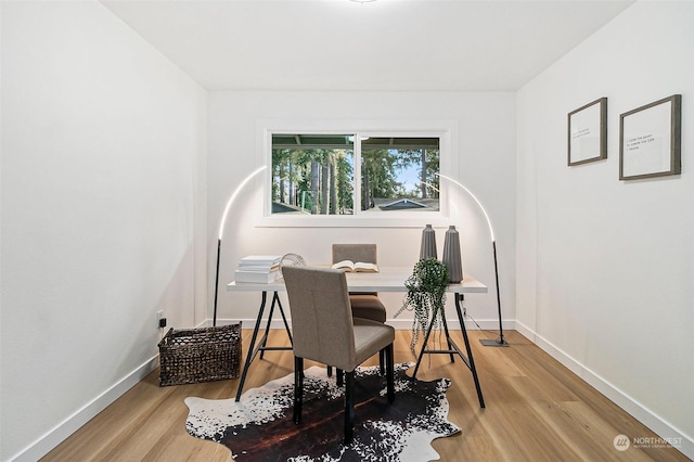 office space with wood-type flooring