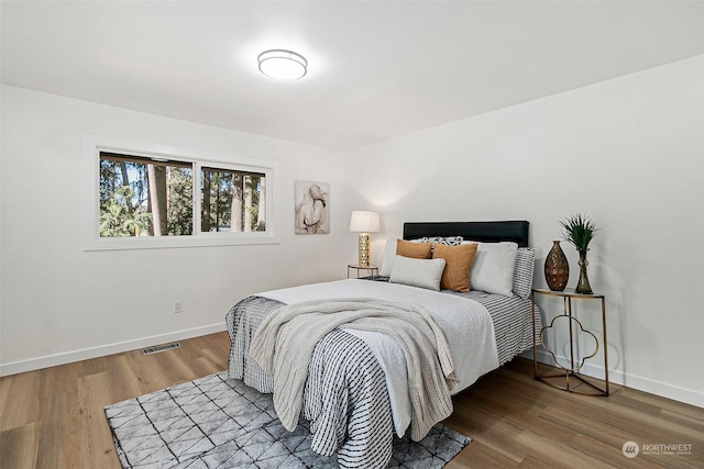 bedroom featuring hardwood / wood-style floors