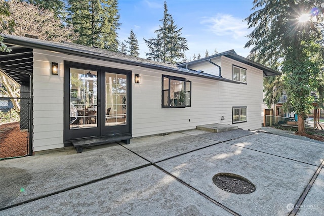 back of house with a patio and french doors