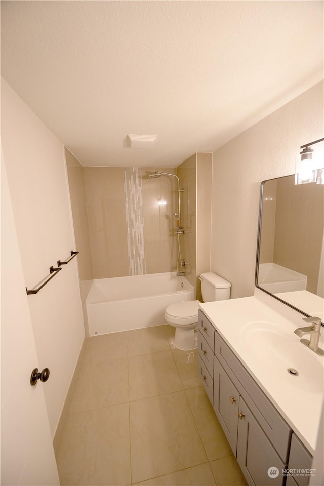 full bathroom featuring toilet, a textured ceiling, vanity, tiled shower / bath combo, and tile patterned flooring