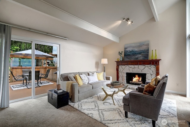 carpeted living area featuring lofted ceiling with beams, a fireplace, and baseboards