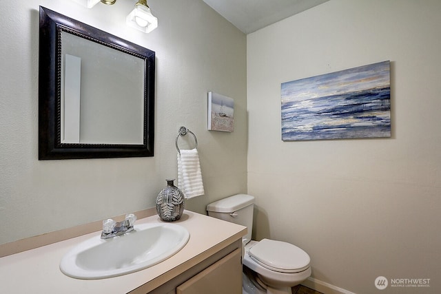 bathroom with vanity and toilet