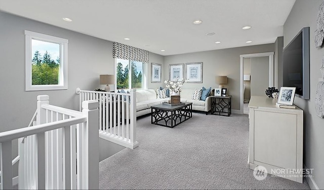 carpeted living room with a healthy amount of sunlight