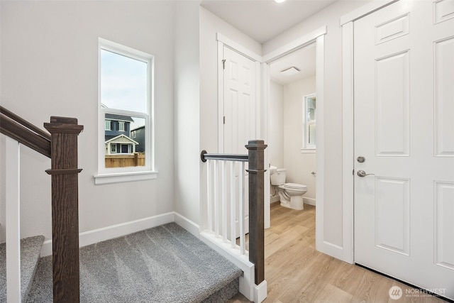 hallway with light hardwood / wood-style flooring