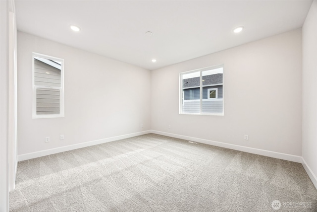 unfurnished room with carpet flooring