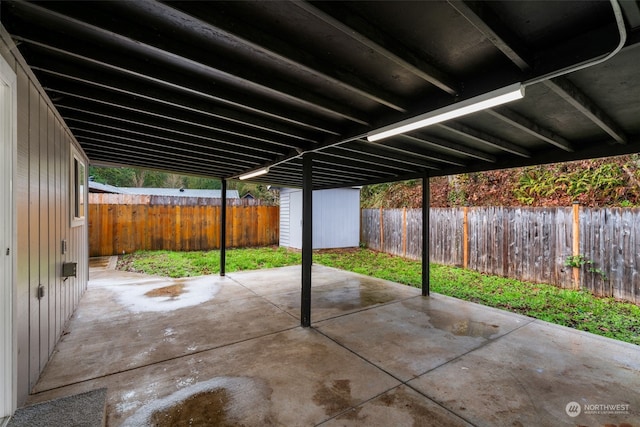 view of patio / terrace with a storage shed