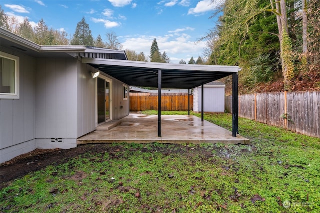 view of yard with a patio area and a shed