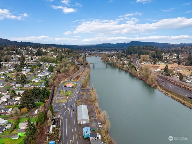 aerial view featuring a water and mountain view