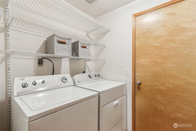 laundry area with washer and dryer